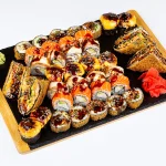 პრემიუმ სეტი (38 ნაჭერი) - ფილადელფია, ოქროს დრაკონი, გამომცხვარი კრაბის და ორაგულის როლი, ცხელი ზაფხული და ორაგულის სენდვიჩი - ტოკიო ჰაუსი ბათუმი